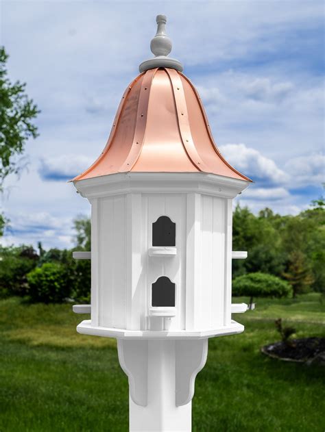 white birdhouse with copper roof